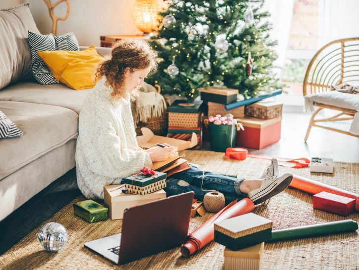 Woman making to do list on 2022 year at notebook.